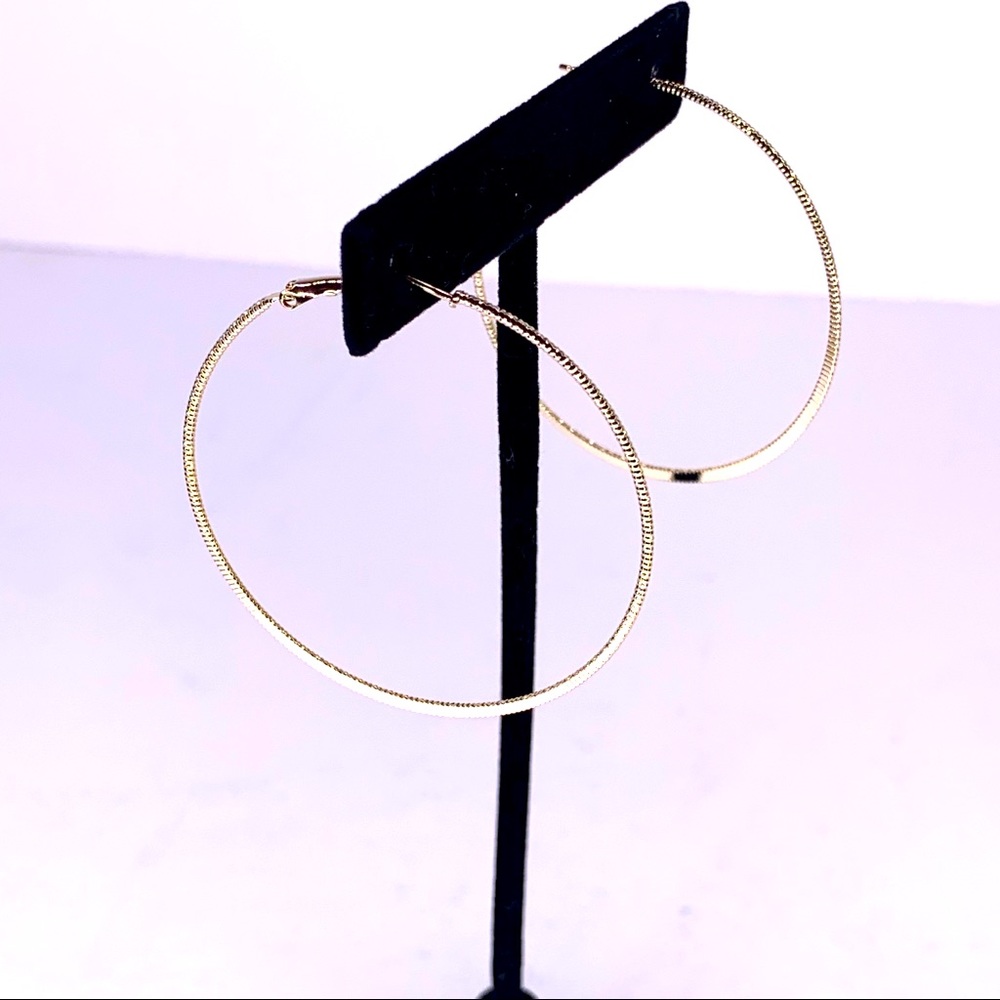 Gold tone pierced hoop earrings 2 inches wide